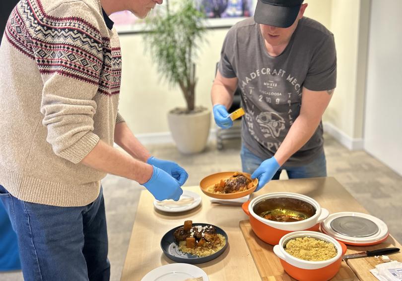 Participants of the cook off plating up dishes at Hightown House