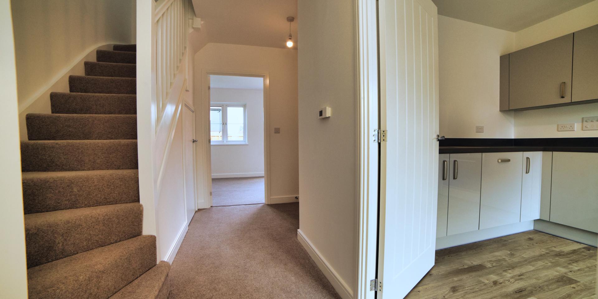The kitchen/diner, living room and downstairs cloakroom all sit off the hallway