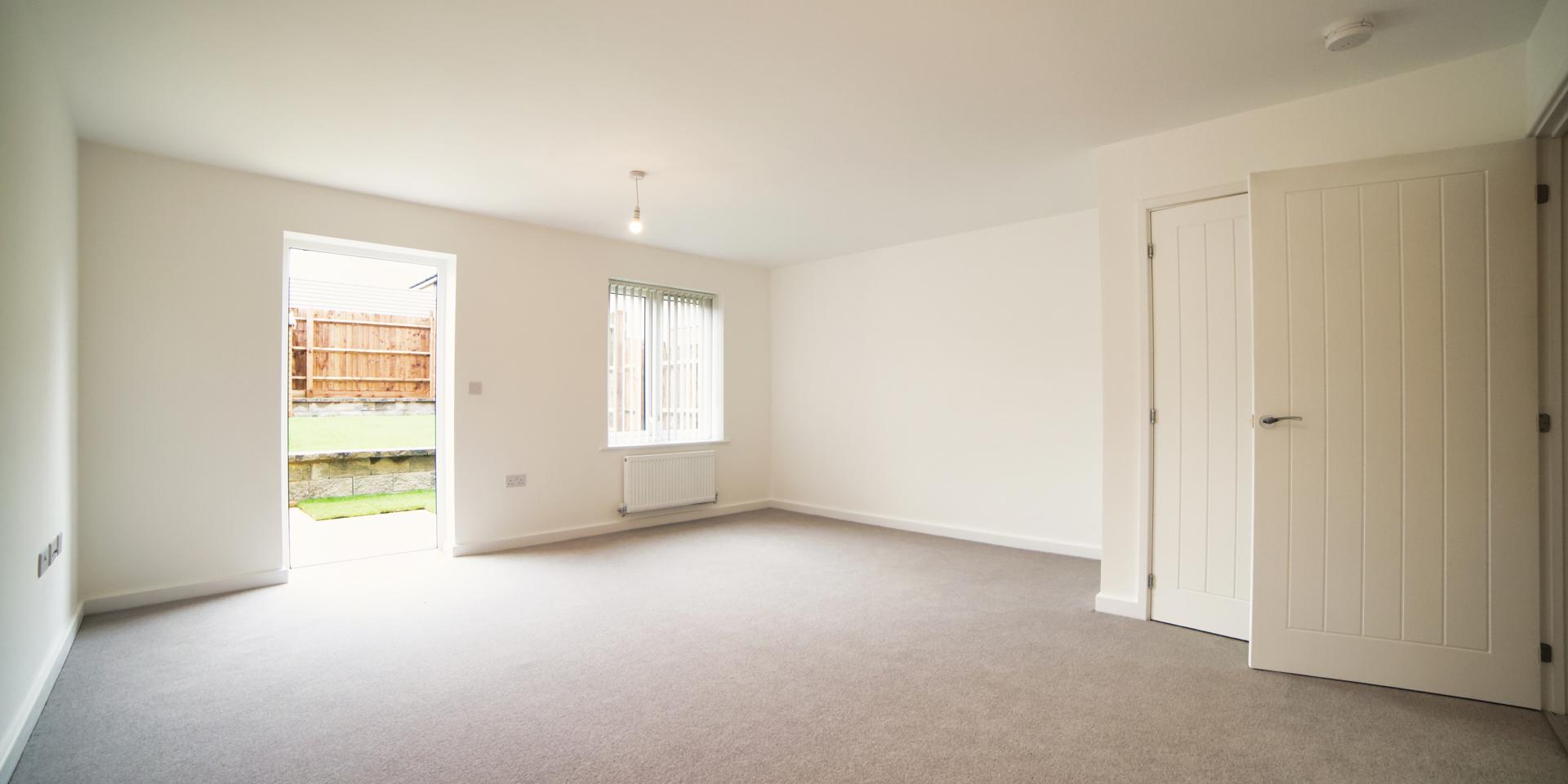 Living area with door leading out to the rear garden