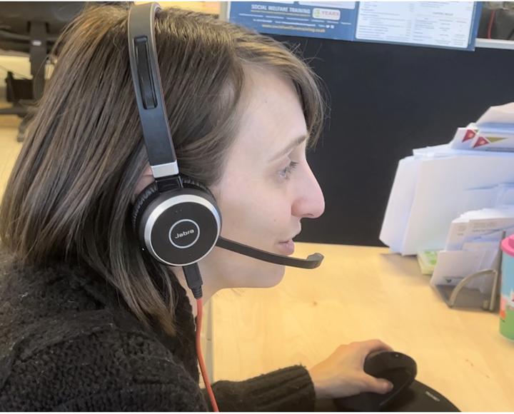 Staff member supporting a resident on the phone