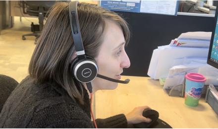 Staff member supporting a resident on the phone