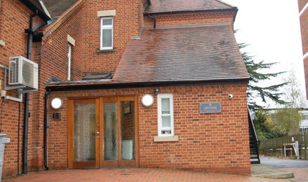 Brick building with a sign which says Open Door homeless service