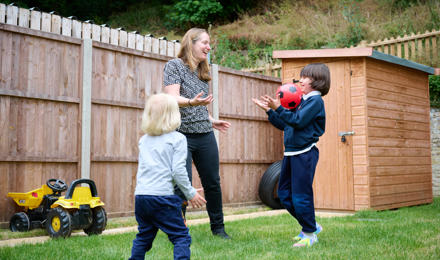 Alice and her children playing in the garden