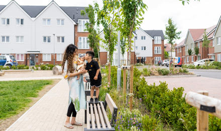 Hightown resident and her two children playing in communal area outside