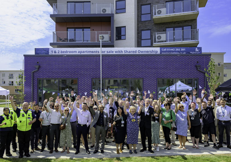 Group of people cheering with arms in the air