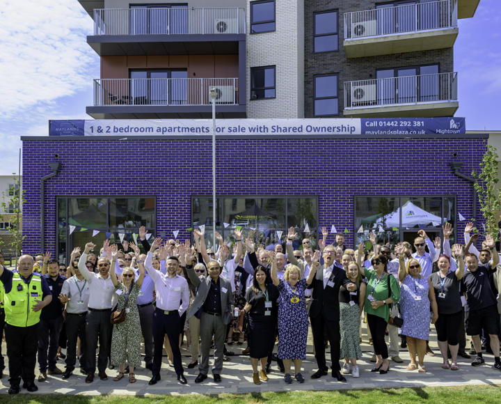 Group of people cheering with arms in the air