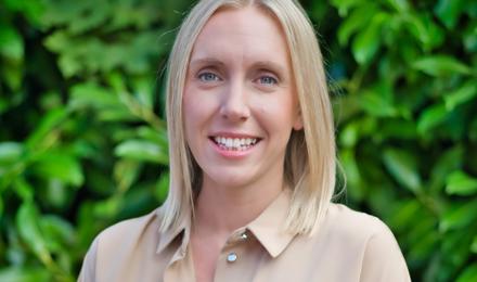 Director of care and supported housing. She is wearing a beige blouse and has shoulder length blonde hair and blue eyes. 