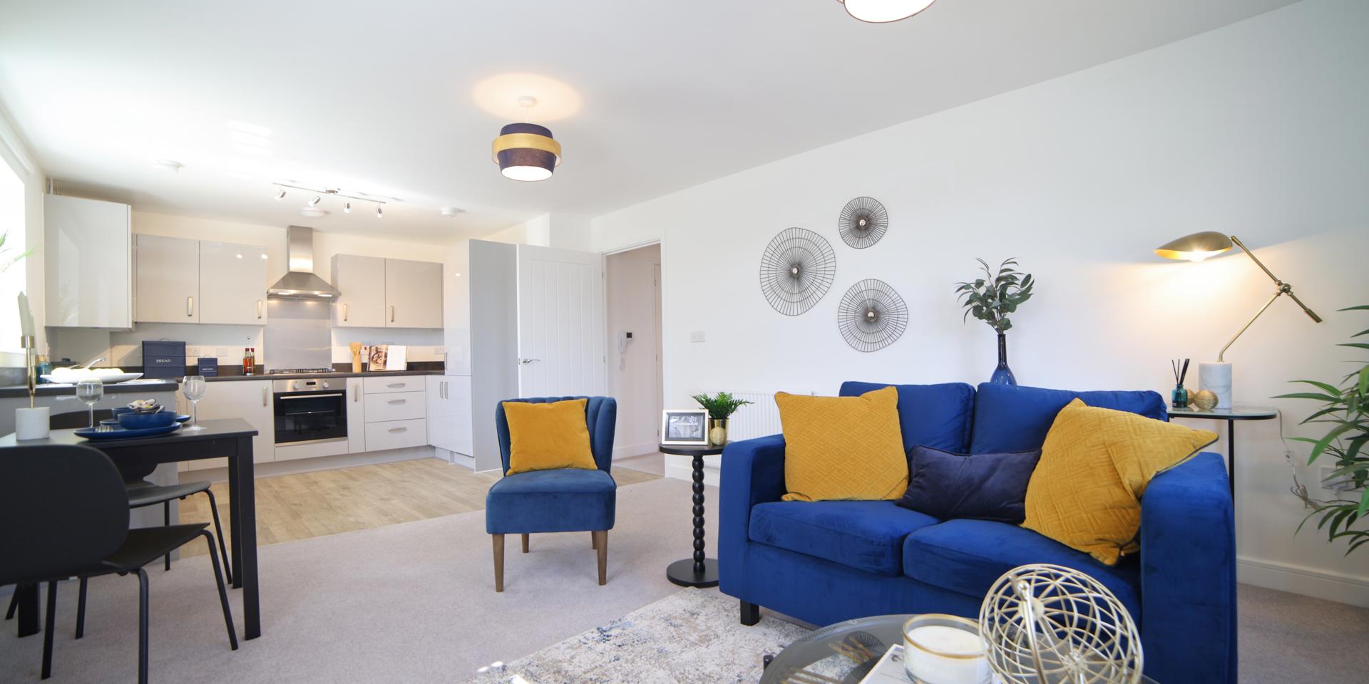 The living area is open plan to the kitchen and dining area. There is room for a small dining table and chairs plus sofas