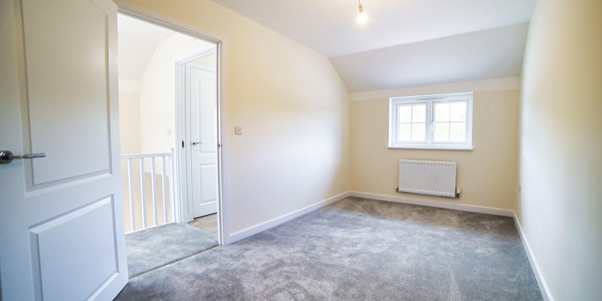 The second bedroom which will fit two single beds