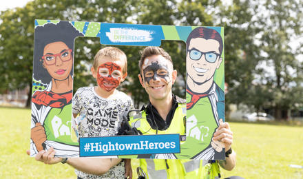 Child and Police officer in face paint at a summer resident involvement event