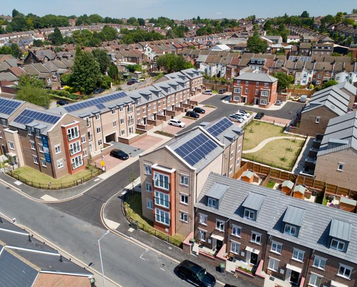 Drone photo of a new housing development in Luton, with a big communal outdoor space