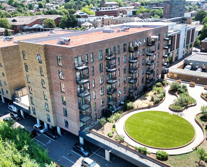 A birds-eye view of the building showing the landscaped gardens