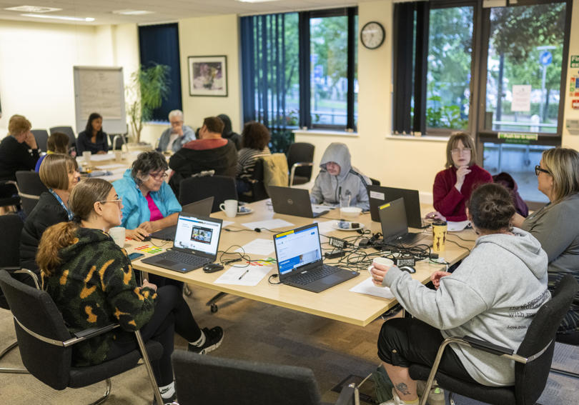 The VoiceBox & RVSP group in disucssions across multiple tables, brainstorming ideas.