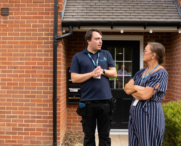 Hightown male property inspector talking to a female member of staff on an estate
