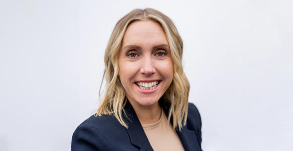 Headshot of the director of care and supported housing, Gemma Richardson. (job share). She is wearing a beige top and black blazer. She has shoulder length blonde hair and blue eyes.