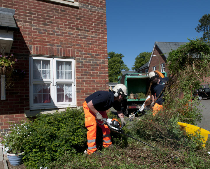 Hightown staff doing grounds maintenance 