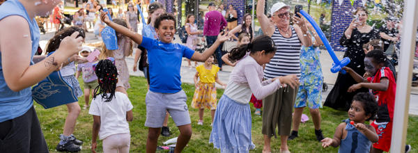 Children smiling and laughing at summer event