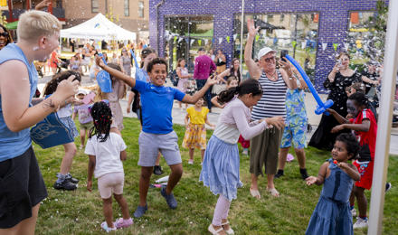 Children smiling and laughing at summer event