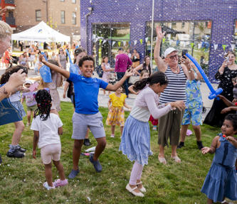 Children smiling and laughing at summer event