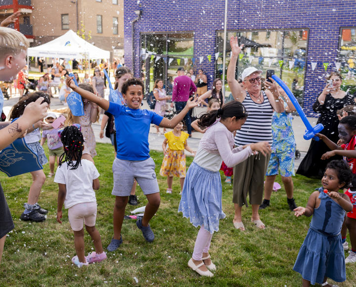 Children smiling and laughing at summer event