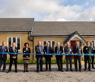 A ribbon cutting ceremony to celebrate new affordable homes