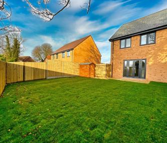 View across the garden from the back corner. It shows the garden shed