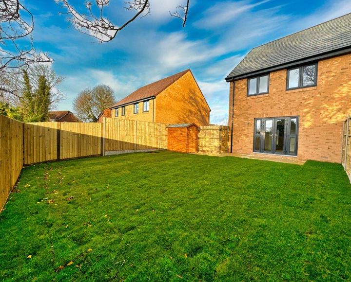 View across the garden from the back corner. It shows the garden shed